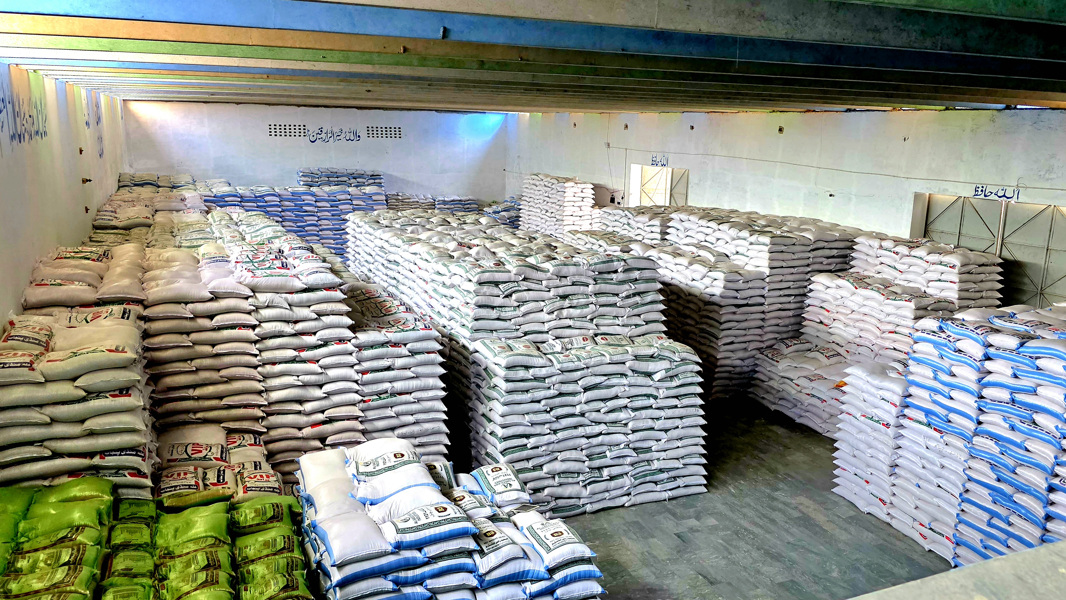 Warehouse view supporting IRRI-6 Rice bulk shipment readiness.